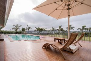 StayVistas Eva Villa - Lakeside Luxury with Modern Decor, Pool & Expansive Lawn - Near Sula