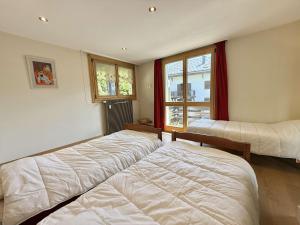 Appartements Appartement cosy au coeur de Praz-Sur-Arly - 5 pers, proche centre et pistes, parking et casier ski - FR-1-603-35 : photos des chambres