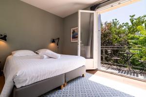 Appartements MonAppart-Hotel - Appartement Lumineux avec Clim et Parking : photos des chambres