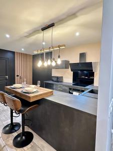 La Suite Aimée - Espace relaxant avec balnéo