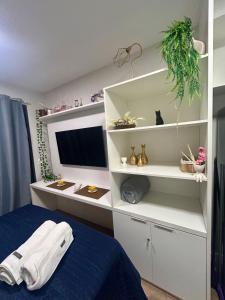 Studio com piscina e vista