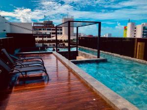 Apartamento Completo na praia com terraço privativo - 2 quartos