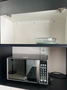 Apê mobiliado com ar e garagem no Lagoa Santa