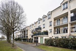 Appartements 10min de Disney Duplex 2ch avec Parking & Balcon : photos des chambres