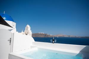 Three Domes Oia - an Iconic Collection