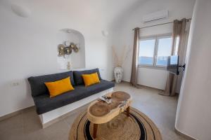 Three Domes Oia - an Iconic Collection