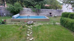 Appartements Appartement dans MAISON de caractere avec jardin et piscine : photos des chambres