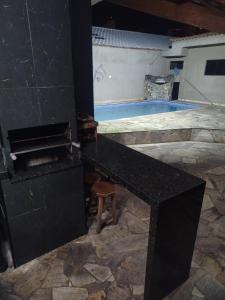 Casa familiar com Piscina Praia Grande