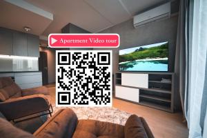 Scan QR code for apartment video tour - free parking, gym access, air conditioning, kitchen and more in central Riga