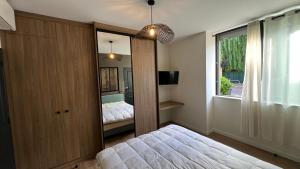 Appartements Chez Max - Terrasse - Climatisation - Parking gratuit : photos des chambres