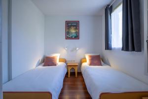 Appartements Ideal famille - piscine interieur chauffee et exterieure : photos des chambres