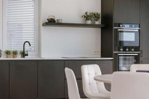 Huswell - New Beach Apartment in De Haan