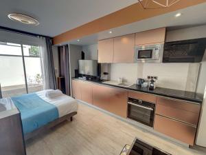Appartements Suite Spa avec Terrasse Privee – Jacuzzi, Sauna Cuisine Equipee : photos des chambres