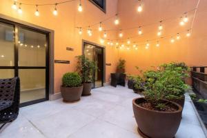 Moderno Aconchegante Studio com Rooftop e coworking