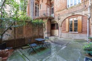 Appartements L-Arche des Carmes - Confort et Calme Hyper-centre : photos des chambres