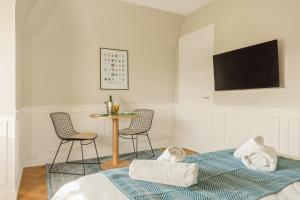 Appartements Le Manoir du Vert Galant : photos des chambres