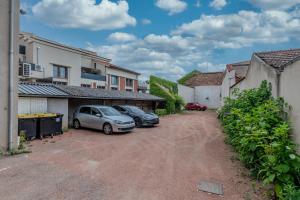 Appartements T2 Dahlia Roanne centre-ville - Parking & Clim : photos des chambres