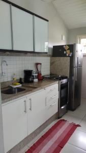 Casa a 20 metros da praia, Wi-Fi em condomínio privado!