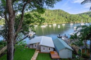 Waterside Retreat with Hillside House and Boathouse in Church Point