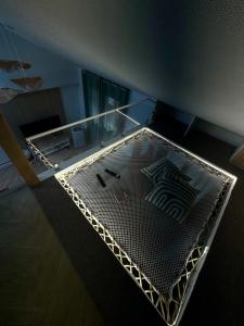 Le Perchoir de Linas, filet suspendu, appartement cosy