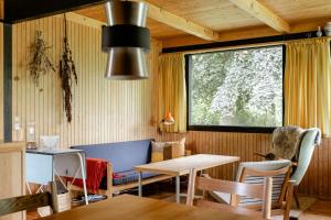 Unique House Surrounded By Willow Trees