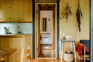 Unique House Surrounded By Willow Trees