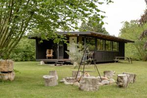 Unique House Surrounded By Willow Trees