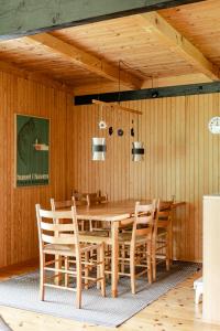 Unique House Surrounded By Willow Trees