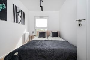 Manufaktura Suites - 76m2, Parking, AirCon - by Rentujemy