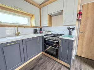 Homely Caravan With Decking And Wifi In Lowestoft Ref 12097B