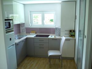 Three-Bedroom Apartment room in Judit Apartman