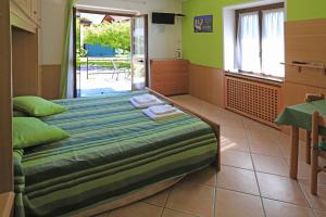 Studio with Garden View (3 Adults) room in North Wind Camping & Apartment