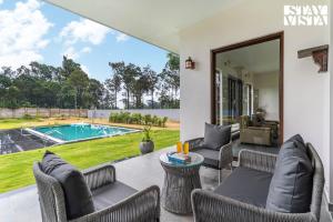 Stayvista at Serenova with big pvt pool and lawn - Your Luxury escape awaits !