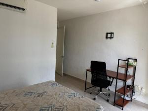 House in front of the Maya Playa del Carmen train