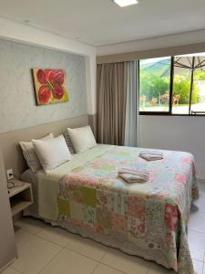 Flat com jardim privativo à beira mar de muro alto