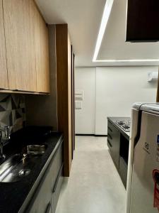 Flat confortável, a 200 metros da praia com estacionamento