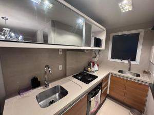 Apartamento com Piscina no Centro e a poucos metros do mar de Torres -RS