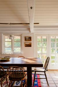 Thatched House Between Forest And Meadow