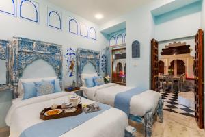SaffronStays Rang Havelii - 2 deluxe rooms in heritage haveli with rooftop pool, chhatri views & hand-painted Rajasthani decor