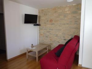 Appartements Aux Pierres de Nozieres : photos des chambres