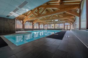 Appartements l-Ours Bleu A35 - Ski in Ski out - Happy Rentals : photos des chambres