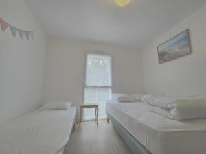 Appartements Appartement neuf 62 m², 5 couchages, a 250 m de la plage - balcon, jardin prive, et parking inclus - FR-1-364-111 : photos des chambres