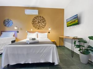 Jacuzzi 200m da praia Wi-Fi AC Churrasqueira