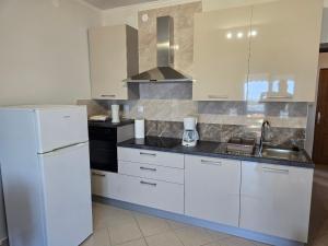 Apartments with parking spaces Palit, Rab - 24756