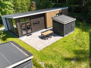 Holiday home surrounded by water and forest