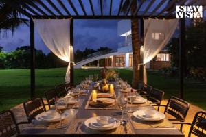 StayVista at Gardenéa with Outdoor Pool, Huge Lawn