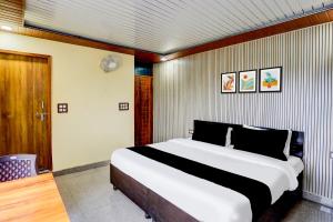 SPOT ON Hotel Doon Lotus | Iconic Rooftop Cafe | Party Hall