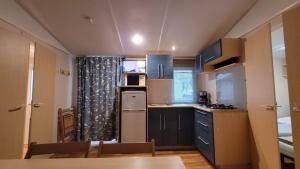 Campings Mobil-home V 3 chambres, climatise, cuisine equipee, TV & Wi-Fi : photos des chambres