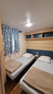 Campings Mobil-home V 3 chambres, climatise, cuisine equipee, TV & Wi-Fi : photos des chambres