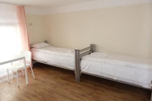 Quadruple Room with Private Bathroom room in Center Hostel and Guest House